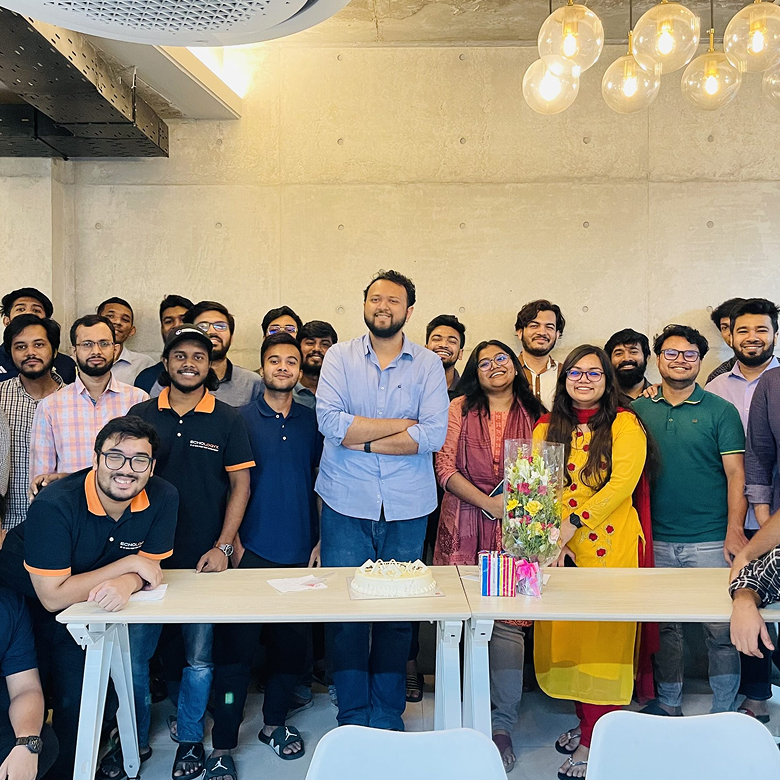 Office celebration with team around table